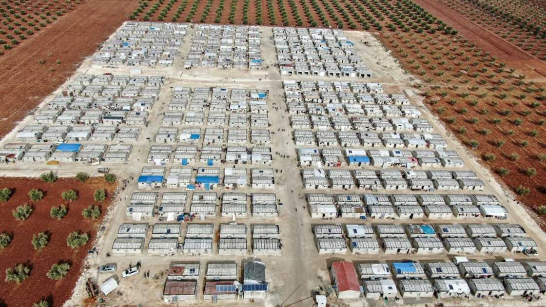 Solar panels on the roofs of cement shelters for Syrian families displaced by conflict in the village of Niyarah Solar panels on the roofs of cement shelters for Syrian families displaced by conflict in the village of Niyarah