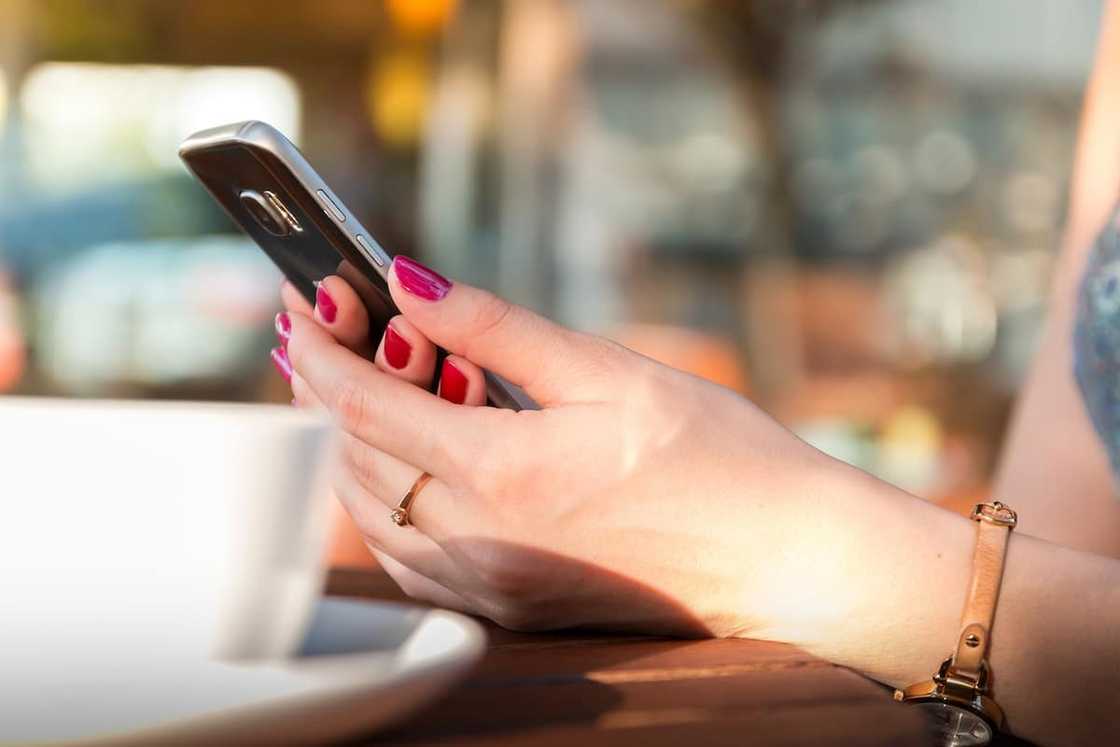 A woman holding a phone