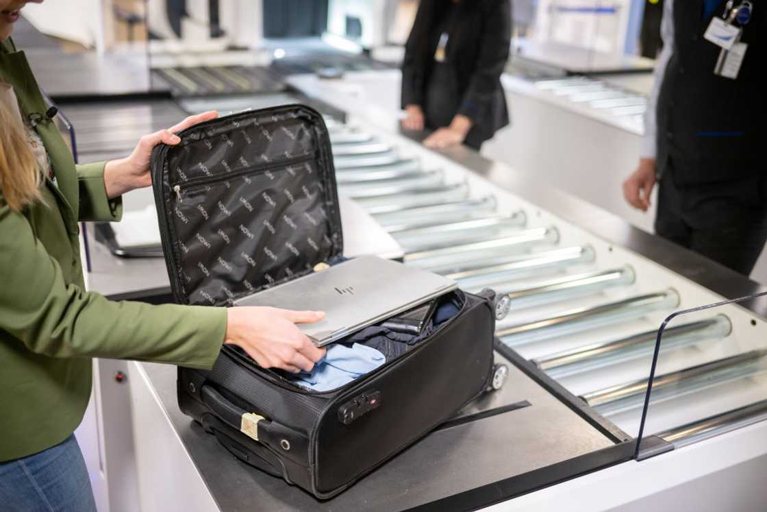 A luggage undergoing security check at the airport