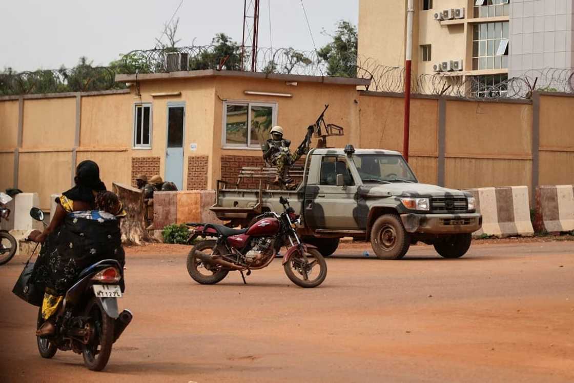 Soldiers patrol the streets of Ouagadougou after shots rang out during the morning