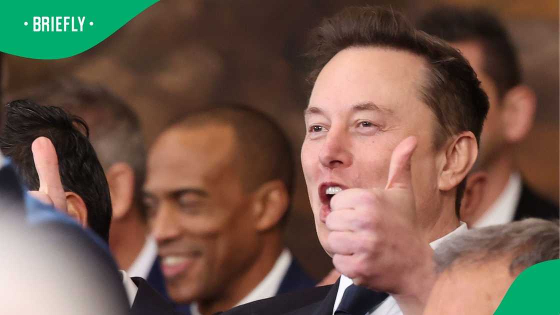Elon Musk giving a thumbs up during Donald Trump's speech Elon Musk giving a thumbs up during Donald Trump's speech