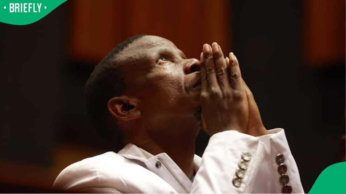 Pastor Mboro is seen praying in court ahead of his bail application judgement.