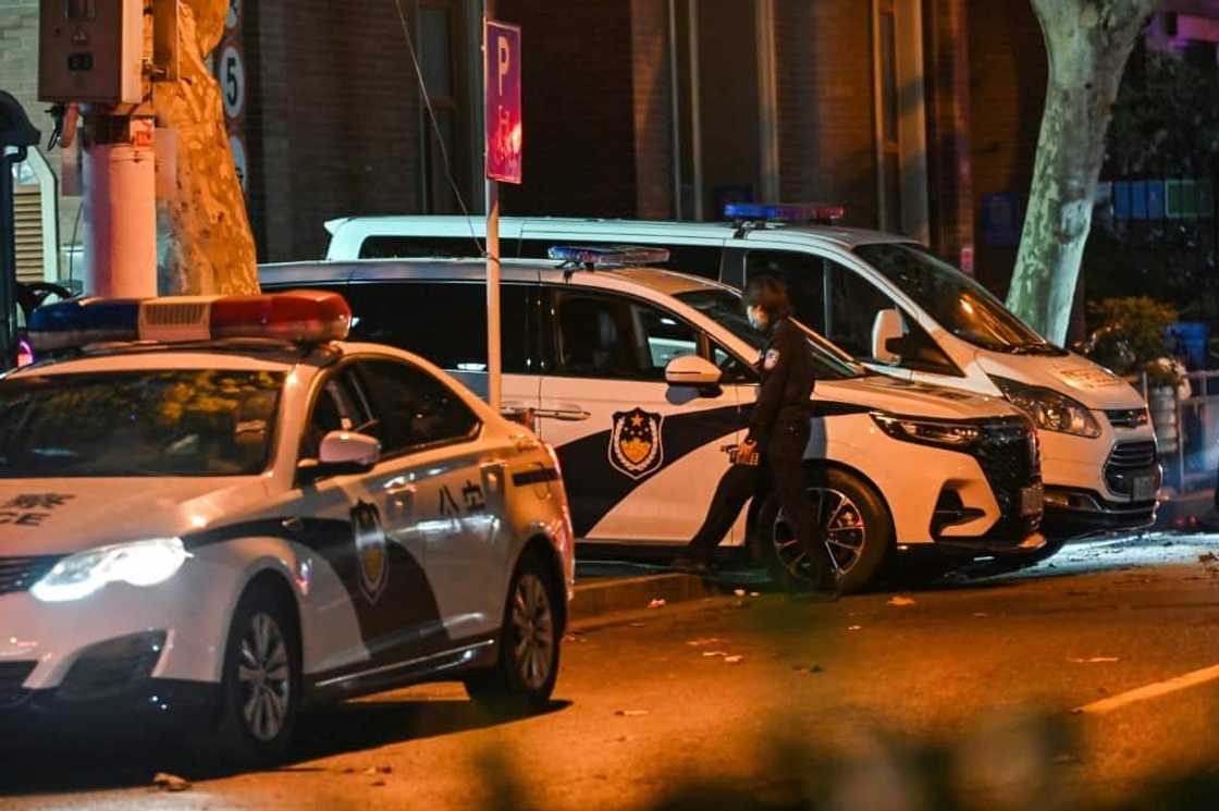 After a day of rare protests in China, police were out in force After a day of rare protests in China, police were out in force