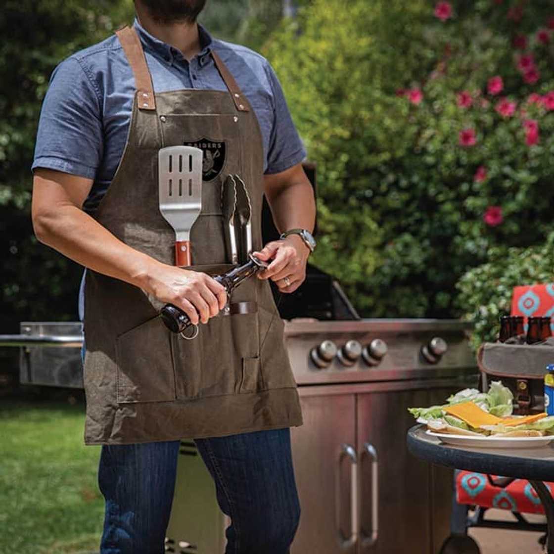 A man wearing a brown men’s BBQ apron A man wearing a brown men’s BBQ apron