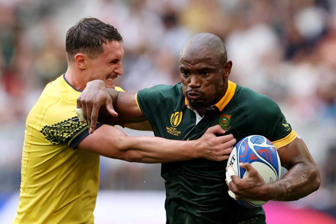 Makazole Mapimpi of South Africa is tackled by Gabriel Rupanu of Romania during the Rugby World Cup France 2023 match between South Africa and Romania Makazole Mapimpi of South Africa is tackled by Gabriel Rupanu of Romania during the Rugby World Cup France 2023 match between South Africa and Romania