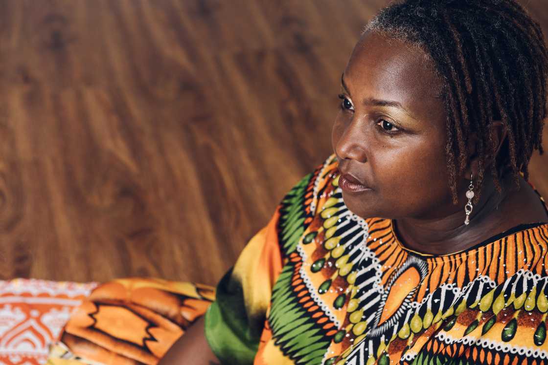 Contemplative black woman.