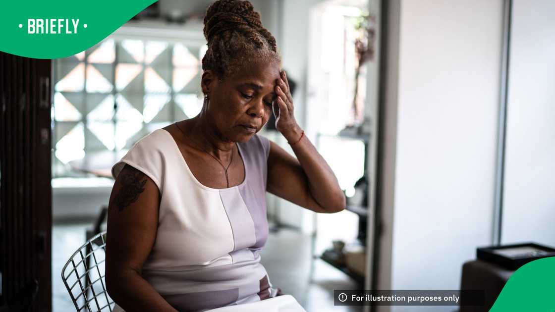 A picture of a black elderly woman who is stressed A picture of a black elderly woman who is stressed
