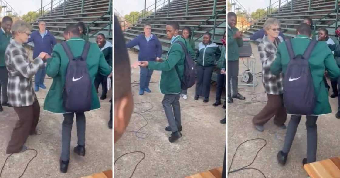 A schoolboy and his older teacher dancing A schoolboy and his older teacher dancing