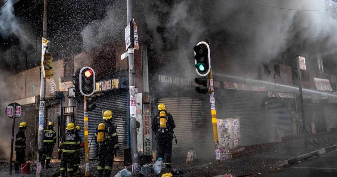 Picture of Firefighters putting out a fire in Johannesburg CBD Picture of Firefighters putting out a fire in Johannesburg CBD