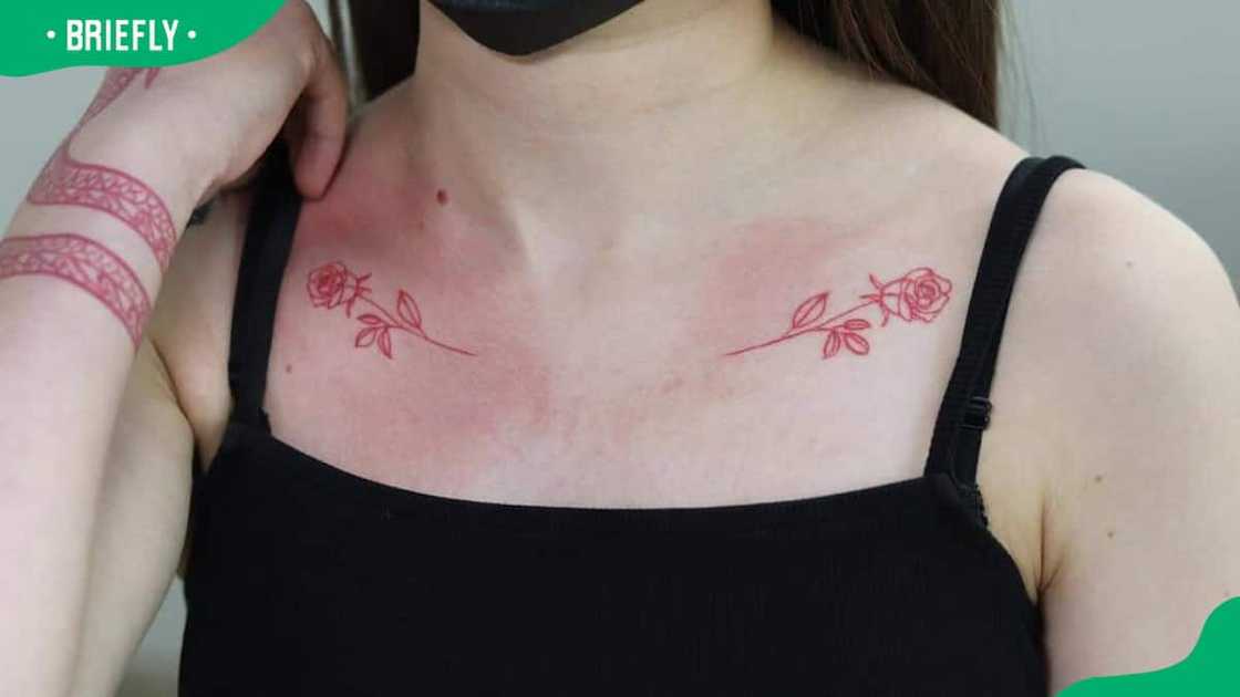 Matching red roses on collarbones Matching red roses on collarbones
