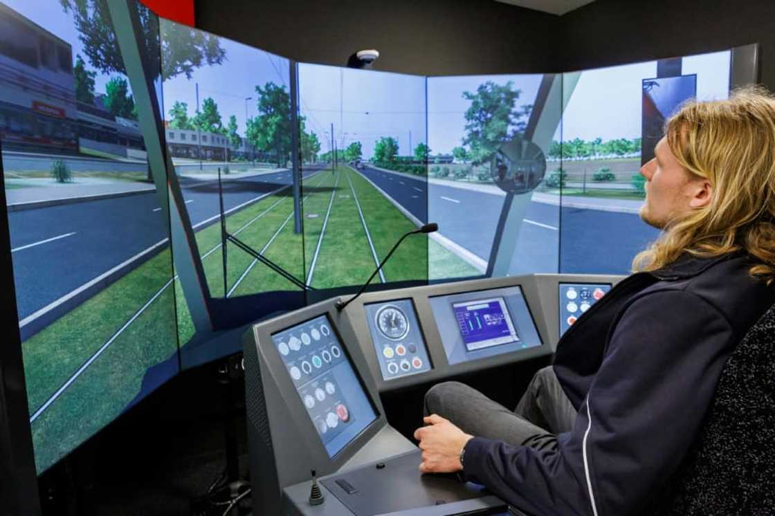 Before practicing on real trams, Benedikt Hanne is trying out his driving skills on a tram simulator Before practicing on real trams, Benedikt Hanne is trying out his driving skills on a tram simulator
