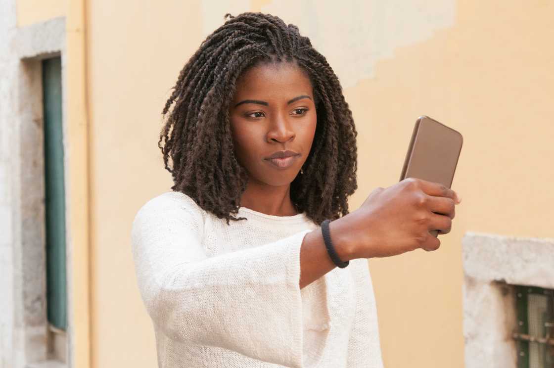 A lady taking a video