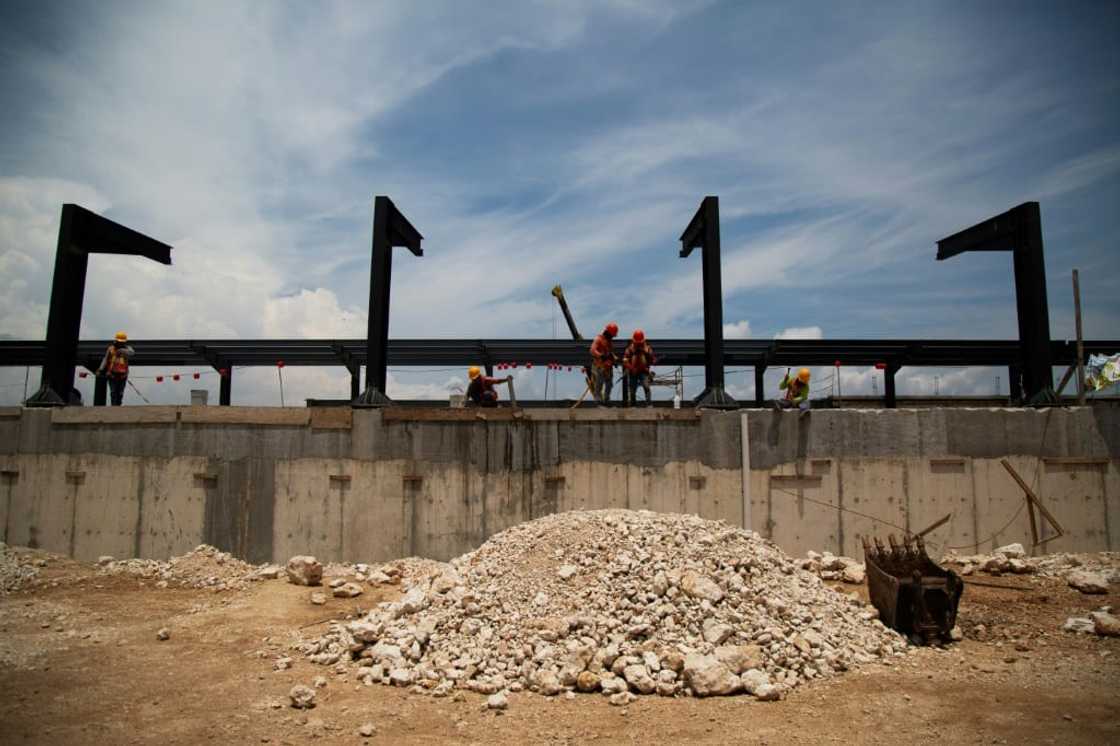 Workers building a rail stop for the Mayan Train in Uman, Yucatan, in Mexico in August 2023 Workers building a rail stop for the Mayan Train in Uman, Yucatan, in Mexico in August 2023