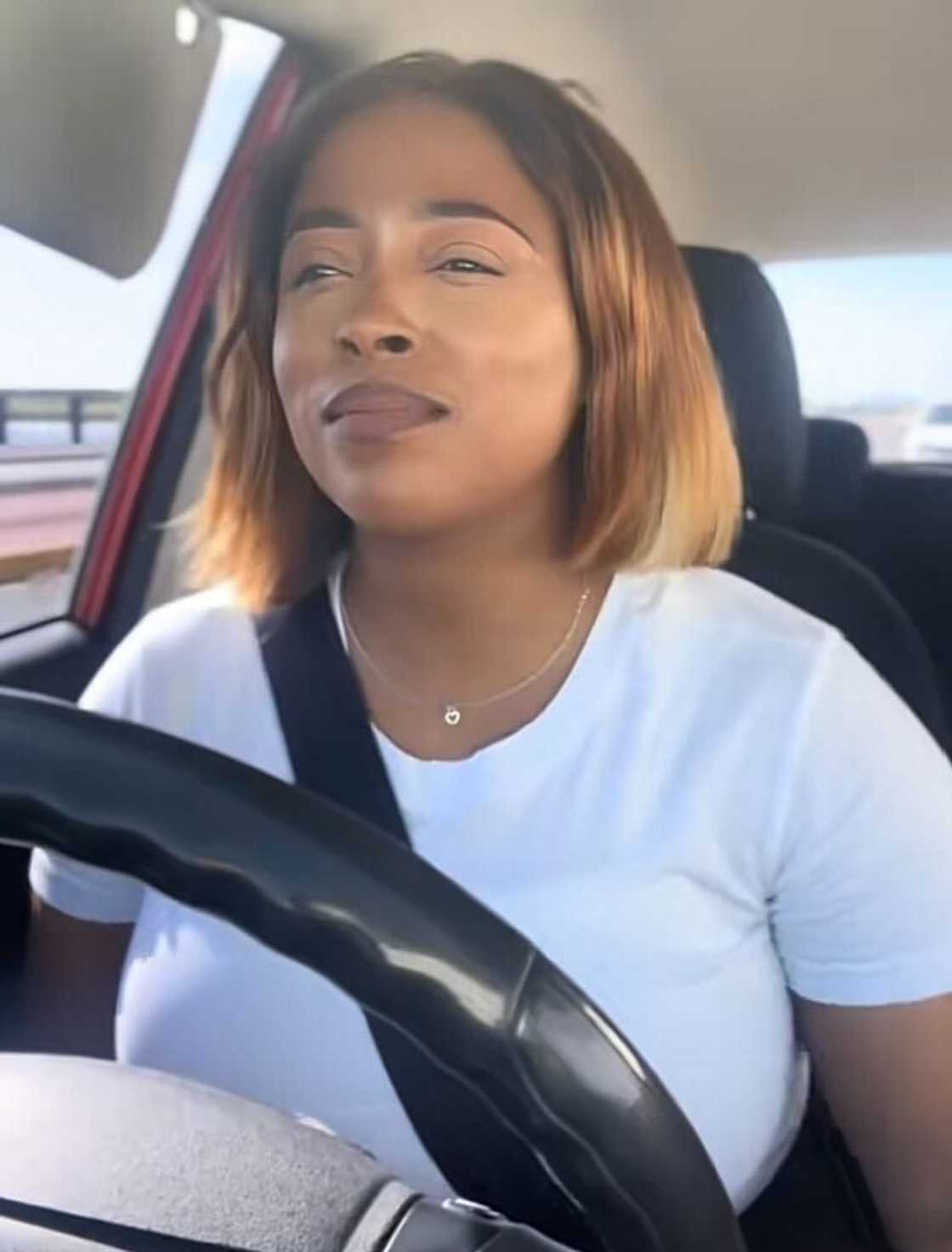 A woman who shared her wig-gone-wrong journey shared a TikTok video driving in a new car.