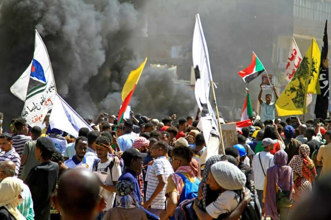 Protesters in Khartoum on Tuesday marching against a military coup: for 12 months, near weekly anti-coup protests have been met with force