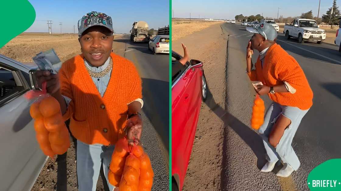 A man wearing heels helped a boy sell oranges.