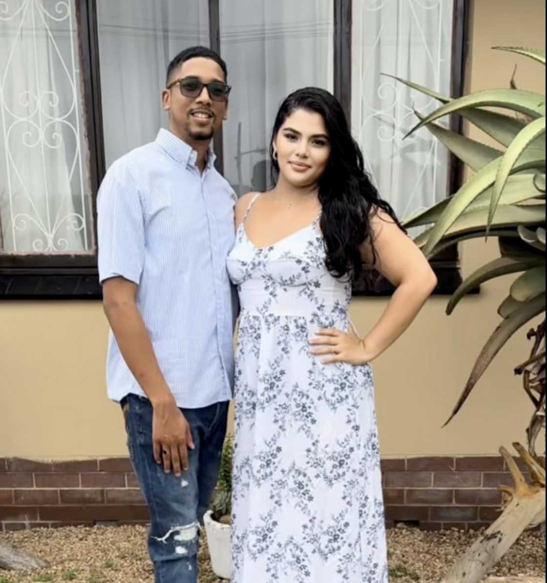 A TikTok photo of a couple in Durban standing in front of a house A TikTok photo of a couple in Durban standing in front of a house