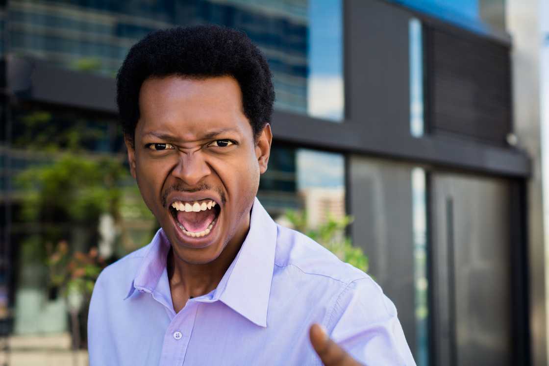 An angry man shouting to someone