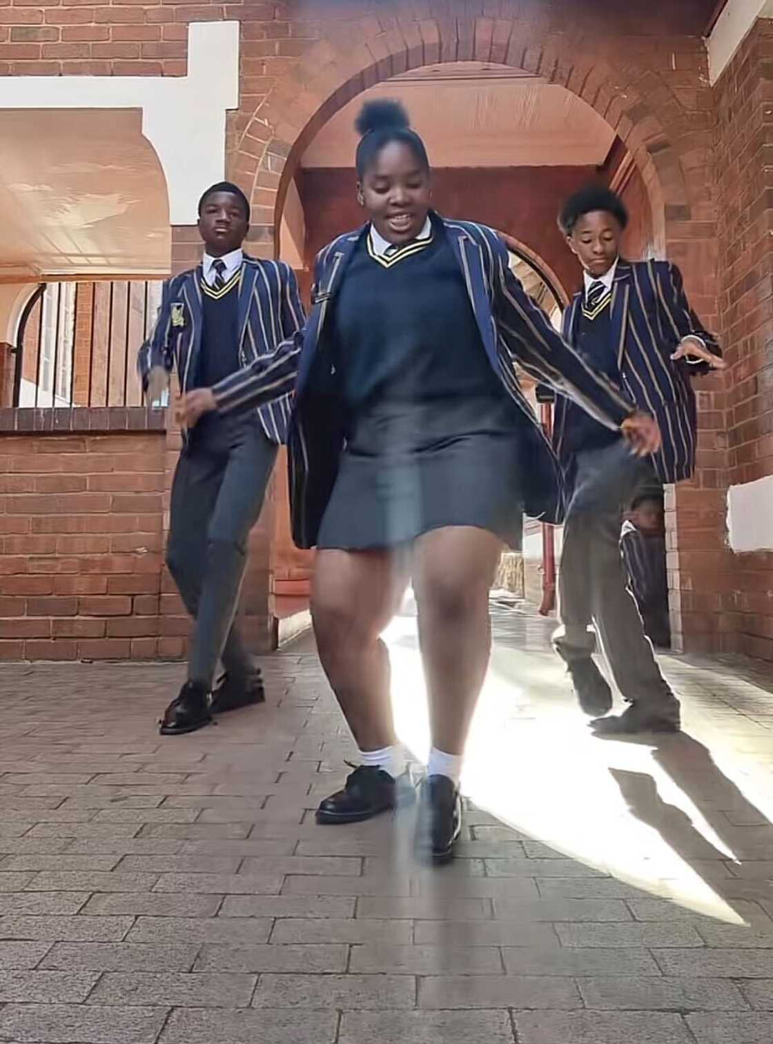 A schoolgirl danced with her fellow classmate in a TikTok video. A schoolgirl danced with her fellow classmate in a TikTok video.