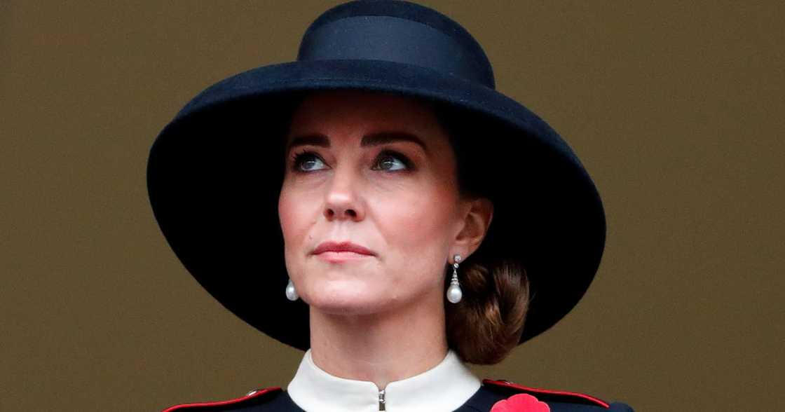Duchess Kate Middleton, Princess Diana, pearl earrings, Alexander McQueen coat, black hat Duchess Kate Middleton, Princess Diana, pearl earrings, Alexander McQueen coat, black hat