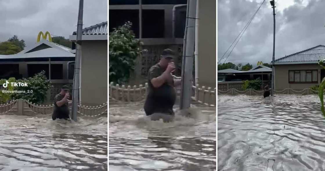 Man stuck in flooded street in Cape Town Man stuck in flooded street in Cape Town