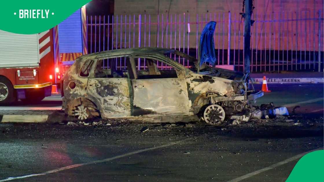 The shell of one of the vehicles was set alight at the mall The shell of one of the vehicles was set alight at the mall