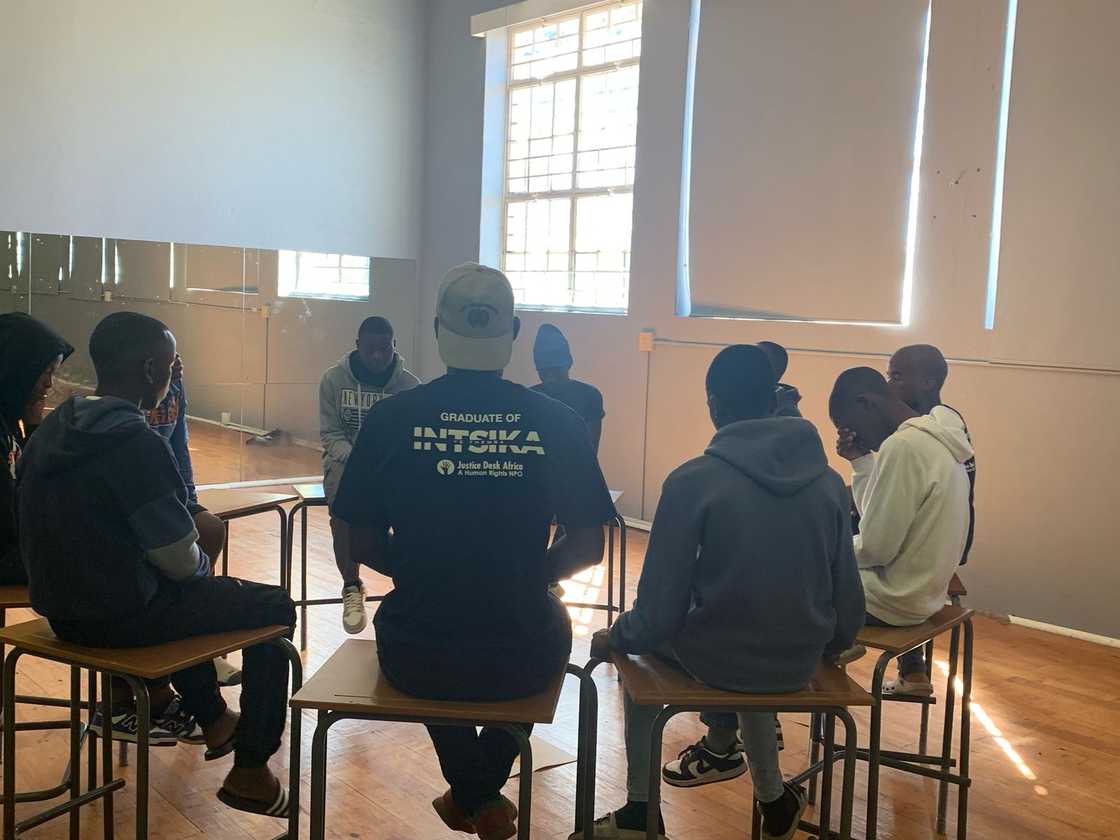 Lerato Kossie and the boys he mentors. Lerato Kossie and the boys he mentors.