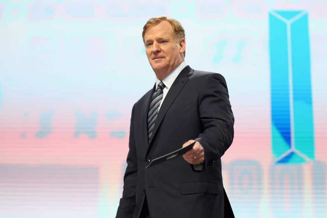 Roger Goodell in a black suit at an event