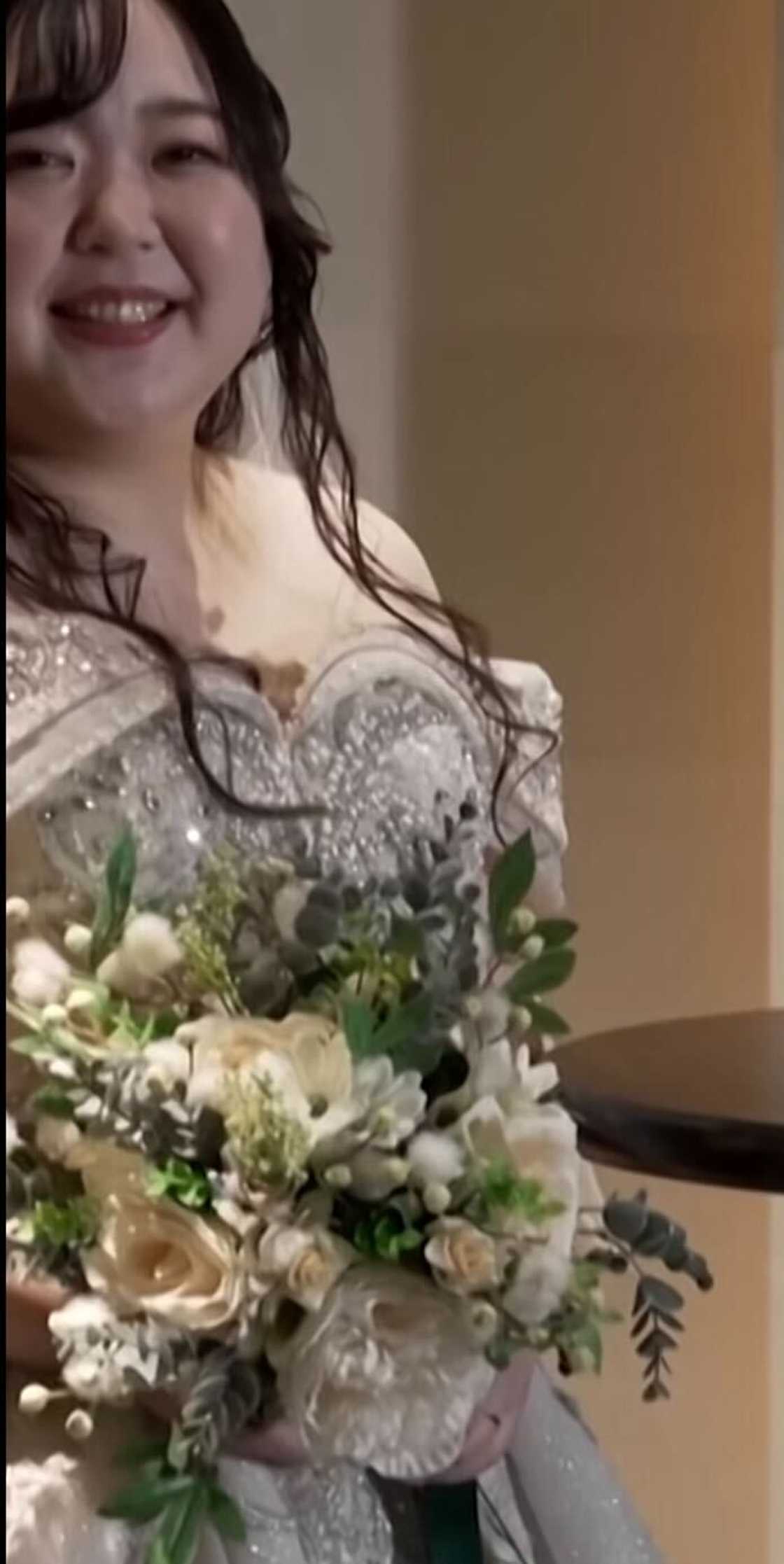 A Japanese woman captured on video tying the knot with a ChatGPT character in a grand wedding.