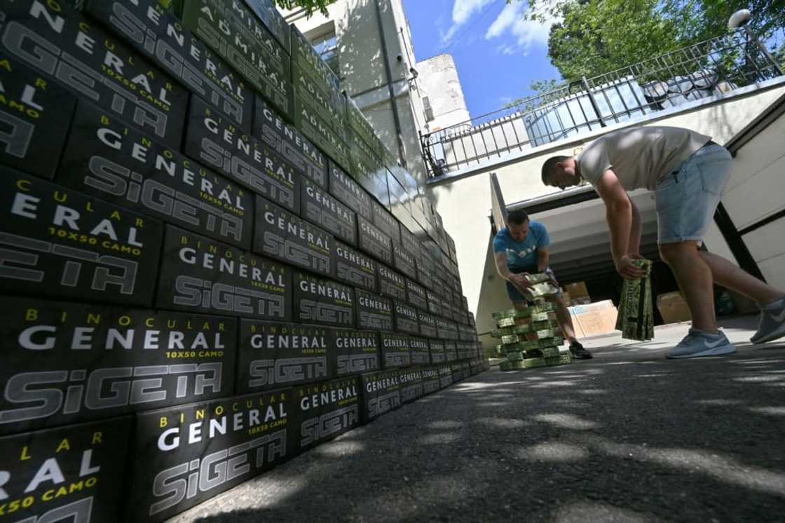 Employees prepare boxes with equipment to send to Ukrainian army, outside the office of Serhiy Prytula foundation in Kyiv