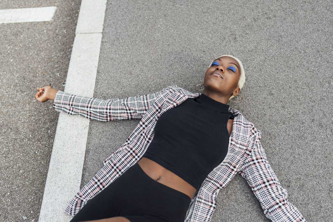 A collapsed woman on the road