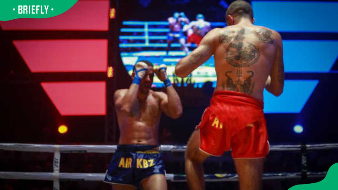 David Leduc, from Canada (red), fights Corentin Jallon from France (blue)