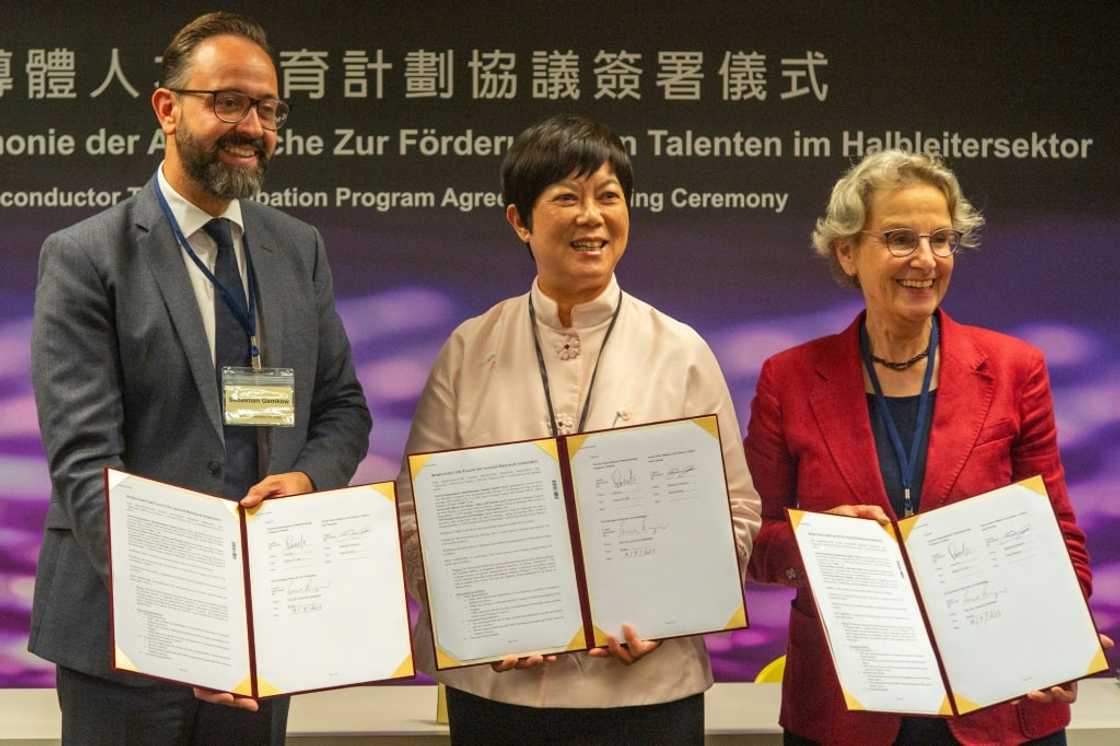 Lora Ho (C), senior vice president of human resources at TSMC, poses with Sebastian Gemkow (L), Saxony state's minister of science, and Ursula Staudinger (R), president of the Dresden University of Technology Lora Ho (C), senior vice president of human resources at TSMC, poses with Sebastian Gemkow (L), Saxony state's minister of science, and Ursula Staudinger (R), president of the Dresden University of Technology
