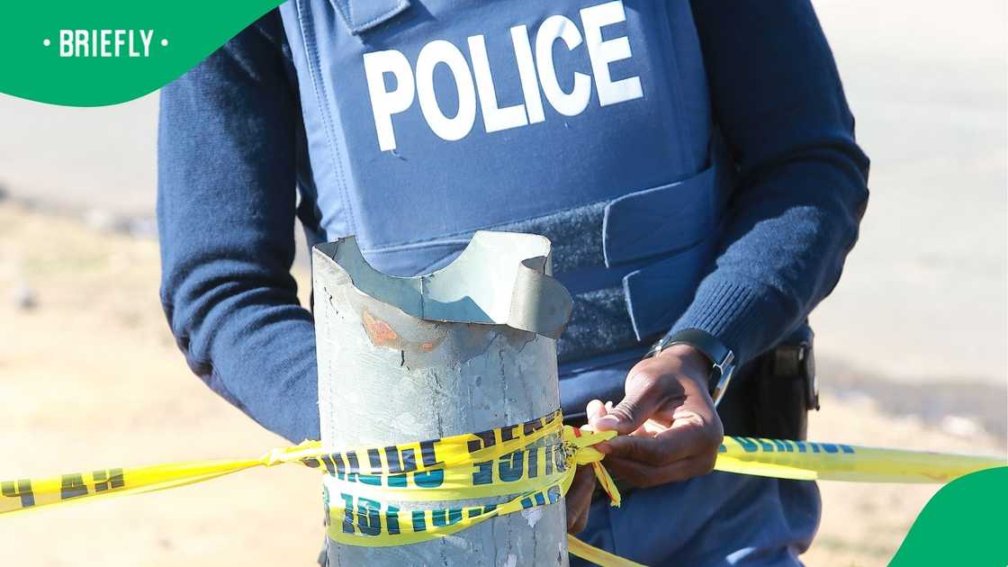 Police cordon off a crime scene. SAPS arrested two men for the brutal murders of two individuals in Mandeni, KwaZulu-Natal. Police cordon off a crime scene. SAPS arrested two men for the brutal murders of two individuals in Mandeni, KwaZulu-Natal.