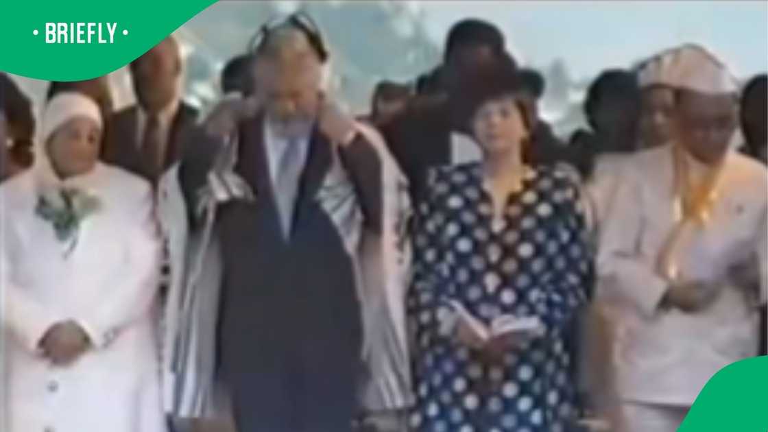 The image showed people in a crowd singing The image showed people in a crowd singing