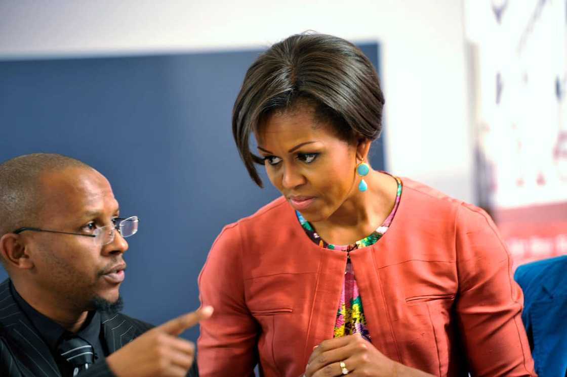Mr Hatang talking to Michelle Obama in 2011 when she visited Johannesburg. Mr Hatang talking to Michelle Obama in 2011 when she visited Johannesburg.
