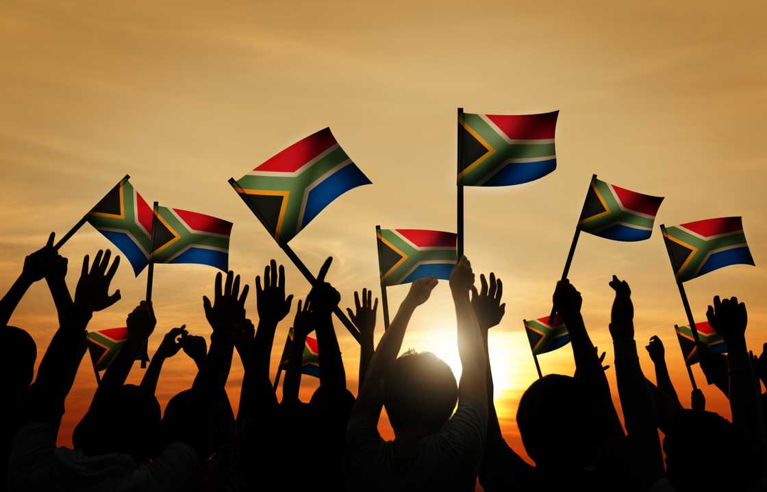 A stock photo of people holding SA flags