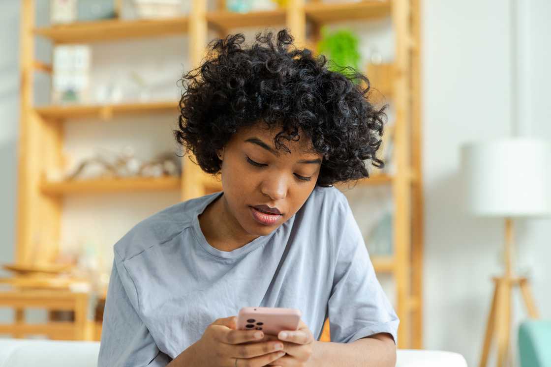 A lady is using her phone