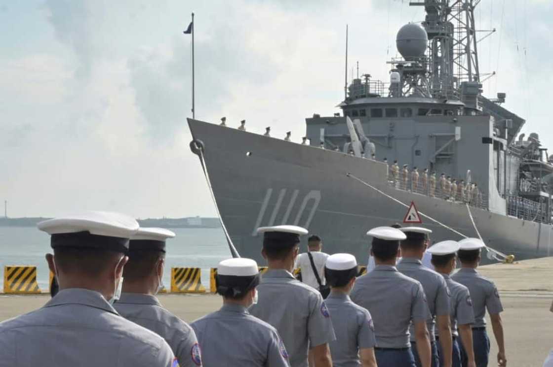 Taiwanese sailors walk in front of a frigate as President Tsai Ing-wen inspects troops on the Penghu islands amid high tensions with Beijing Taiwanese sailors walk in front of a frigate as President Tsai Ing-wen inspects troops on the Penghu islands amid high tensions with Beijing