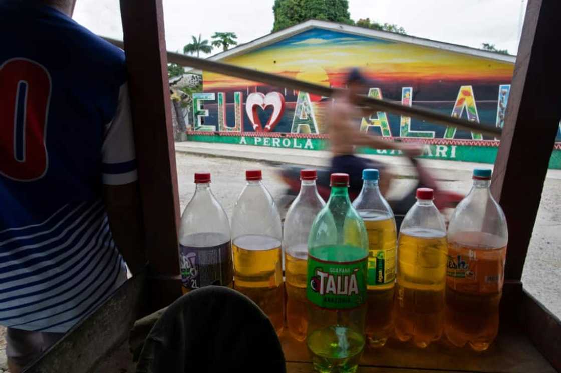 Gasoline is sold in plastic bottles in the streets of Atalaia do Norte