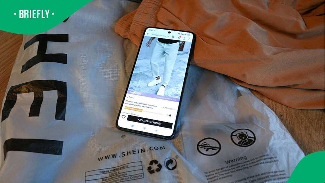 A phone displaying items on sale at reduced prices on the online clothing sales application Shein.