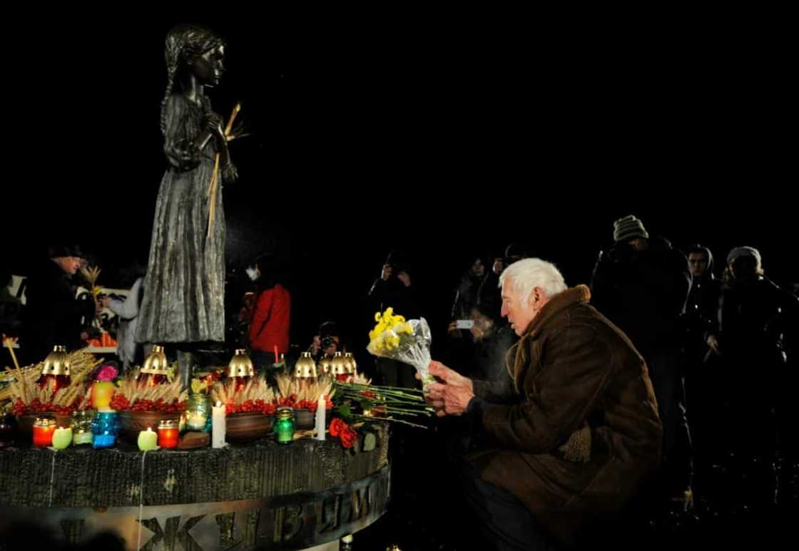 The memorial has a statue of an emaciated girl clutching some stalks of wheat