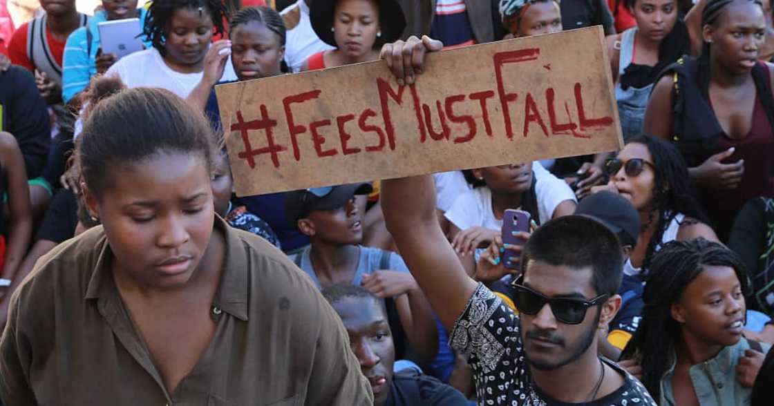 Students protest high cost of tertiary education during #FeesMustFall protests of 2015. Students protest high cost of tertiary education during #FeesMustFall protests of 2015.