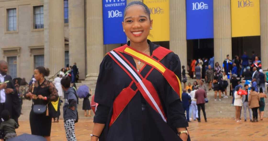 The lady is proud to be a master's graduate from the University of the Witwatersrand The lady is proud to be a master's graduate from the University of the Witwatersrand