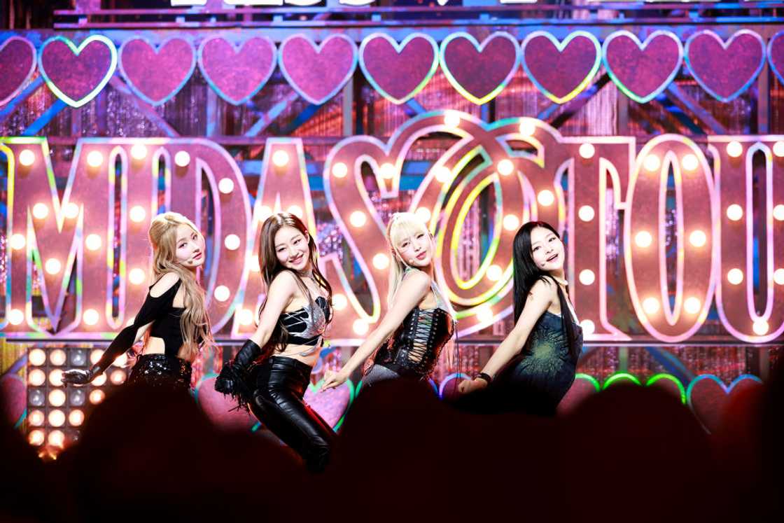 Kiss of Life K-pop band performing onstage Kiss of Life K-pop band performing onstage