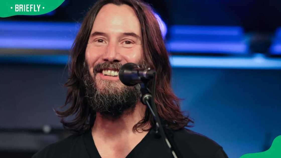 Keanu Reeves performing at the studio