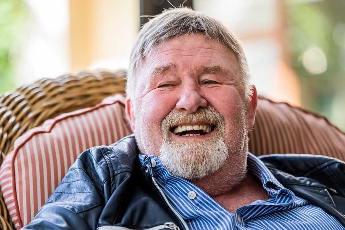 Leon Schuster smiling in a seat Leon Schuster smiling in a seat