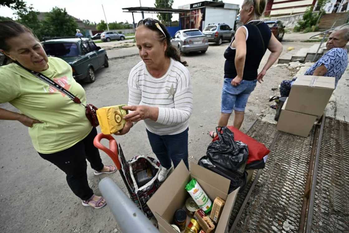 Military notices in local media on locations for aid distribution warn against creating queues