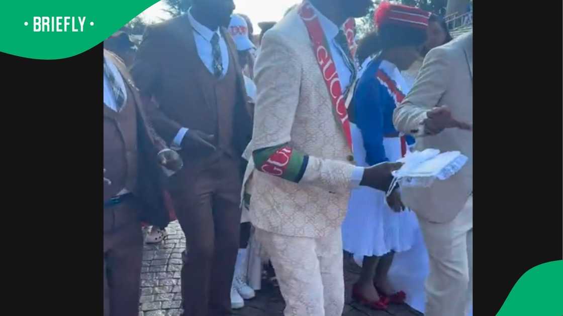 A woman shared a video of a man wearing an unoriginal Gucci suit. A woman shared a video of a man wearing an unoriginal Gucci suit.