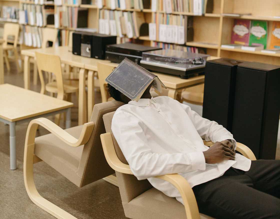 A student sleeping in library A student sleeping in library